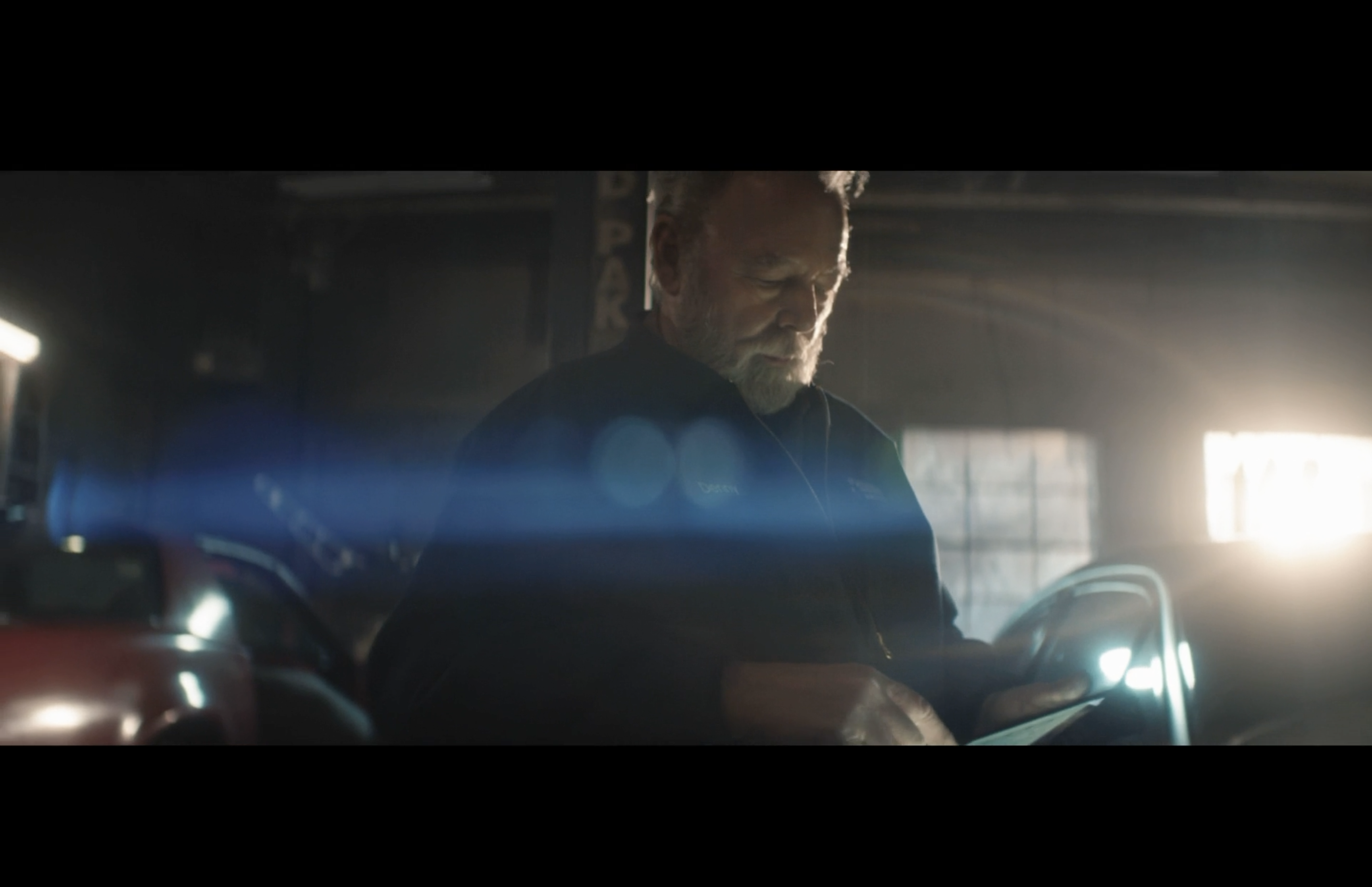 A man working in a warmly lit workshop
